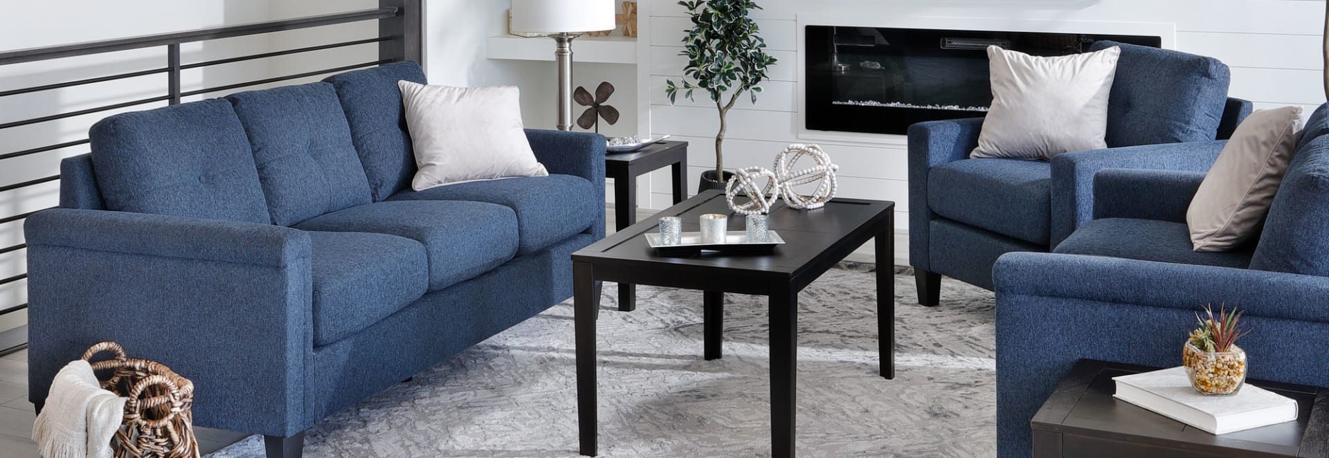 Blue Padded Arm Sofa in Blue in living room with matching chairs