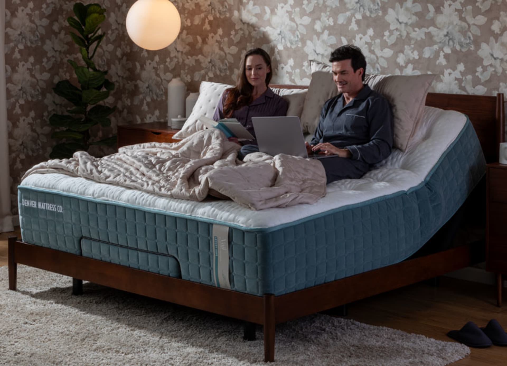 Couple Sitting on Vail Adjustable Mattress in Bedroom