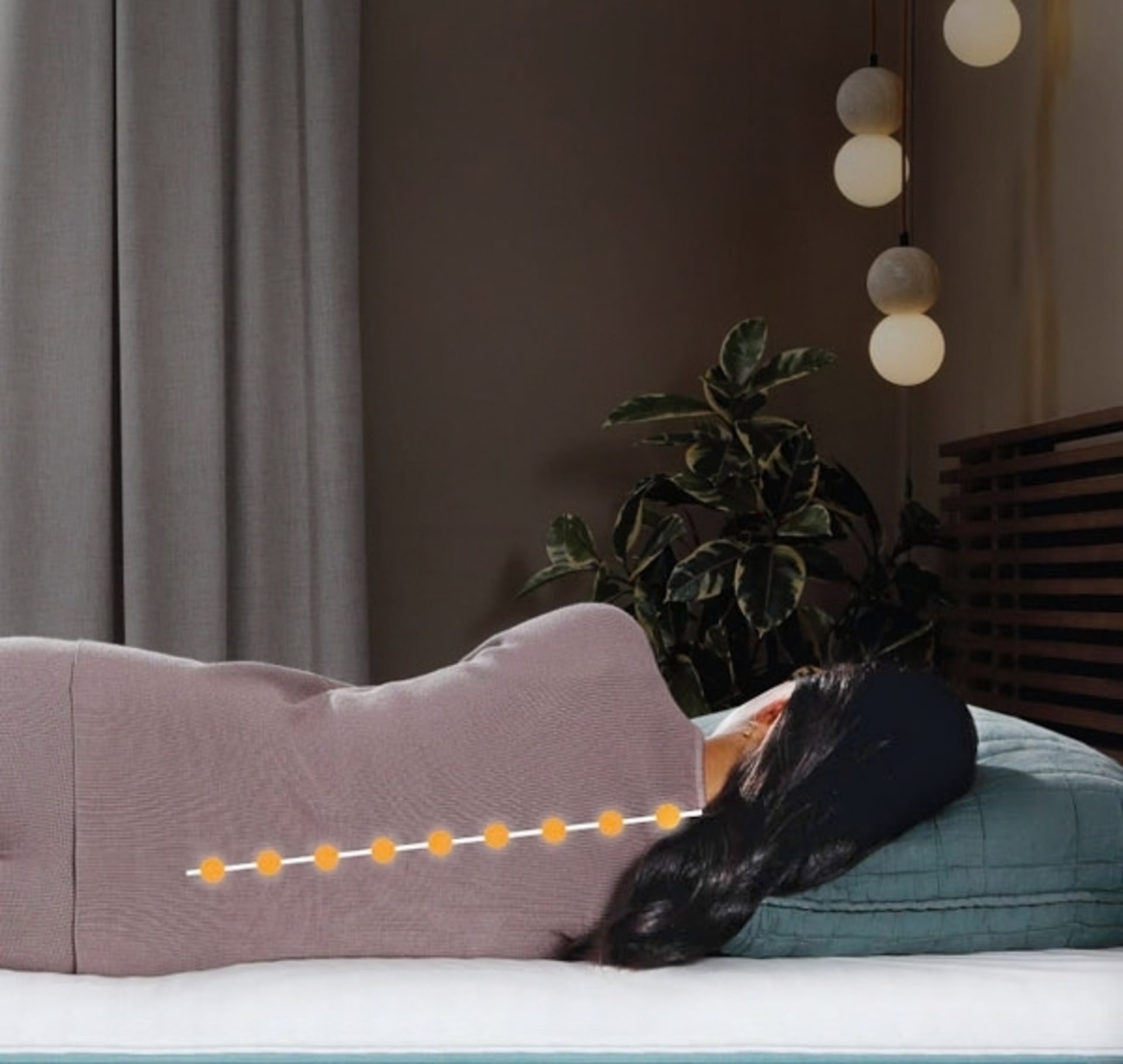 Woman sleeping in bed with spine graphic