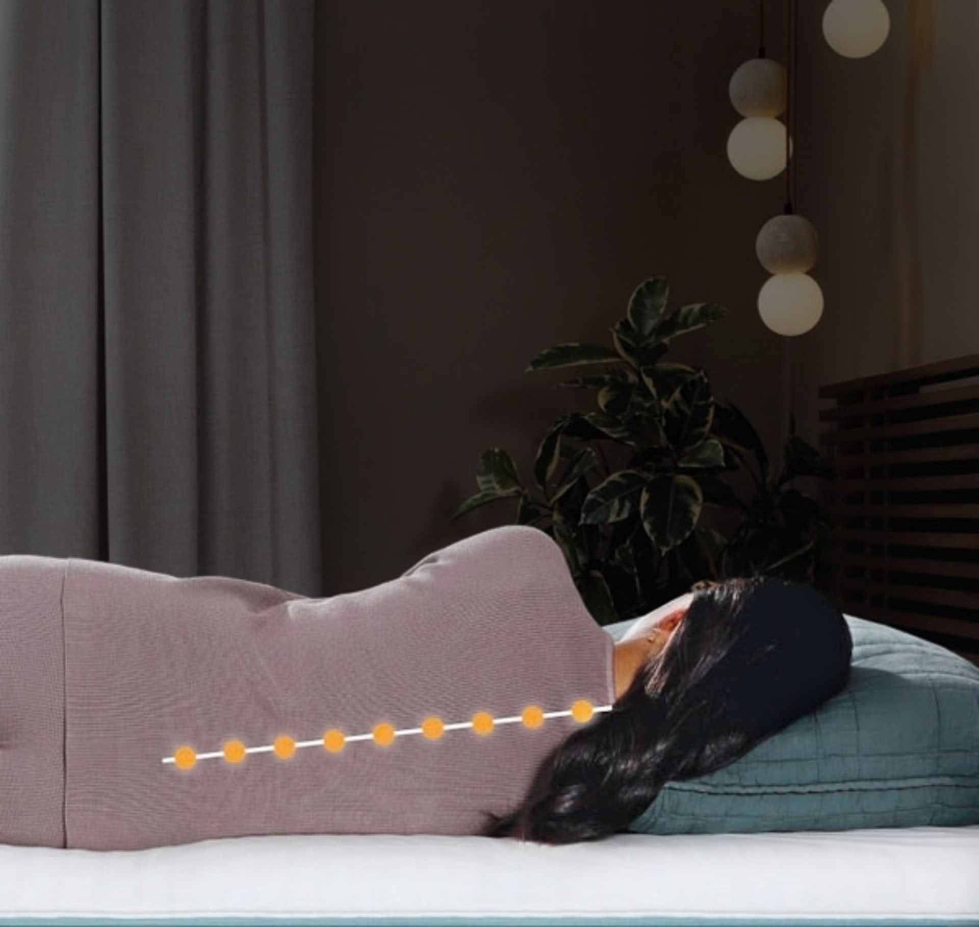 Woman sleeping in bed with spine graphic