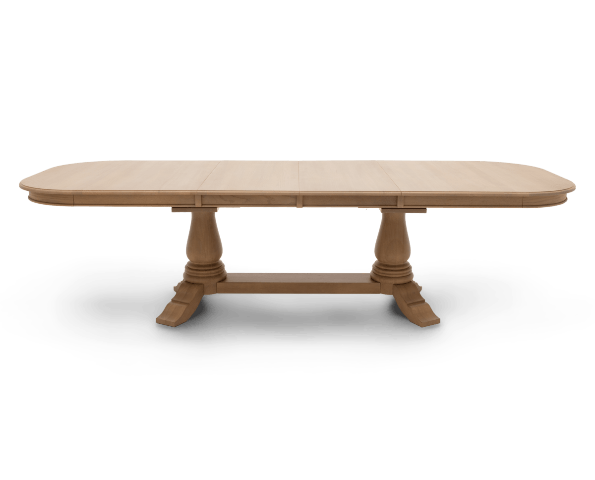 The Heirloom Double Pedestal Dining Table in the Light finish, fully extended and positioned lengthwise