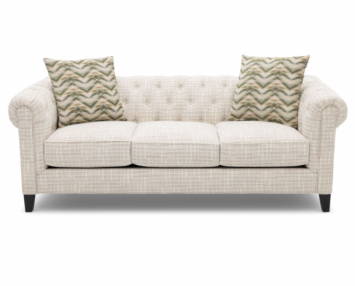 A white chesterfield sofa