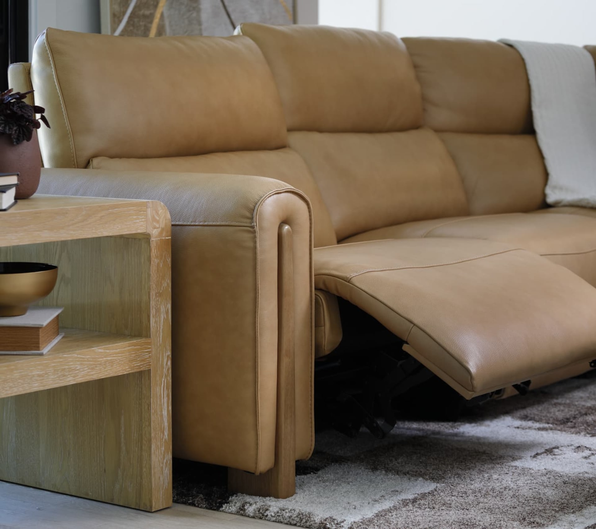 Camel Colored Brown Leather Sectional with Wooden Accents in Living Room