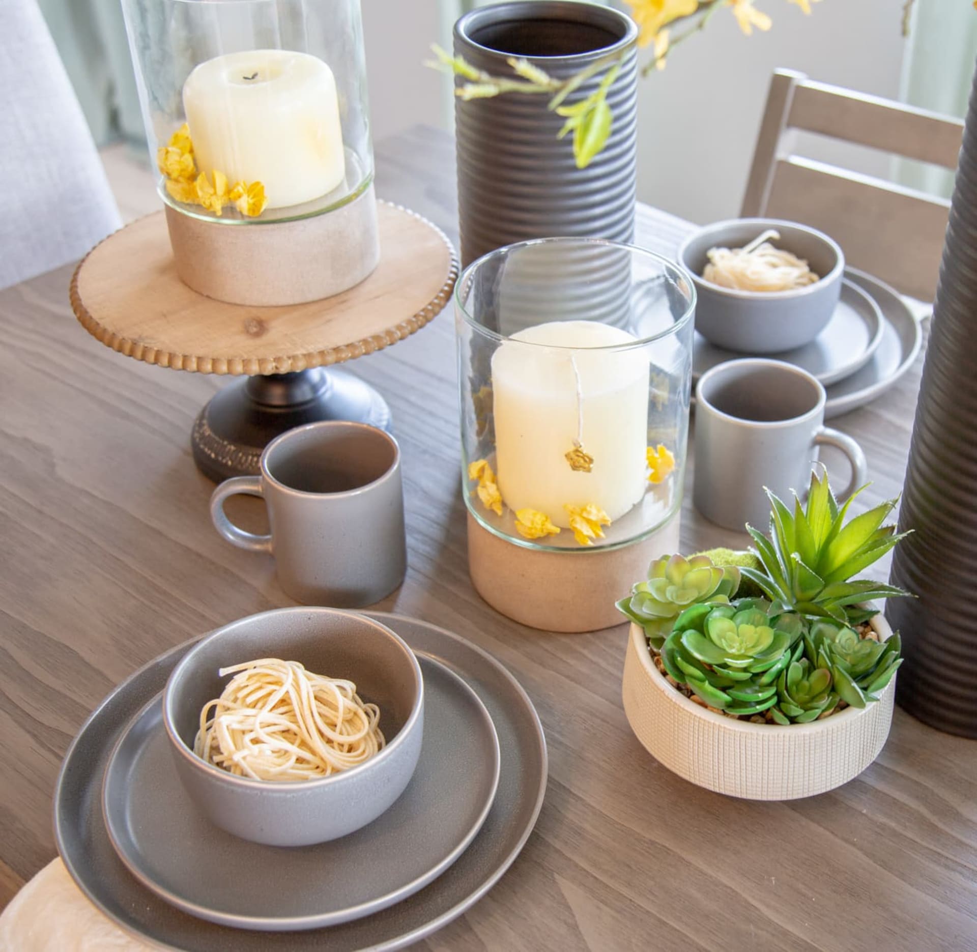 Fall themed candles on a dining table