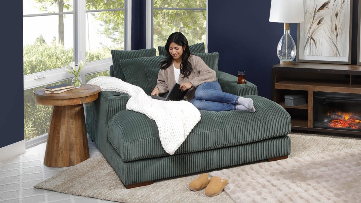 Mondo Fabric Oversized Corduroy oversized chaise in Living room with woman reading