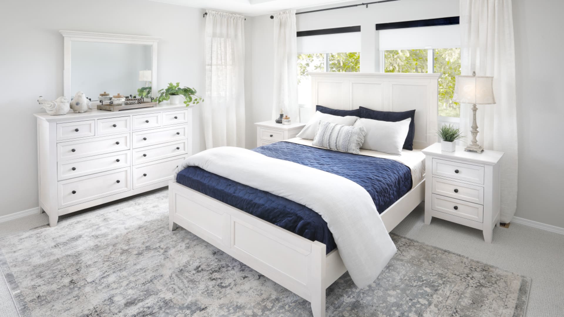White Panel Bedroom set in sunny bedroom.