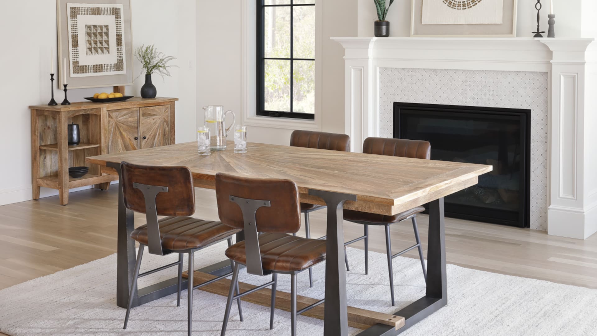 Modern rustic dining set with sunburst inlays and matching server in dining room window scene
