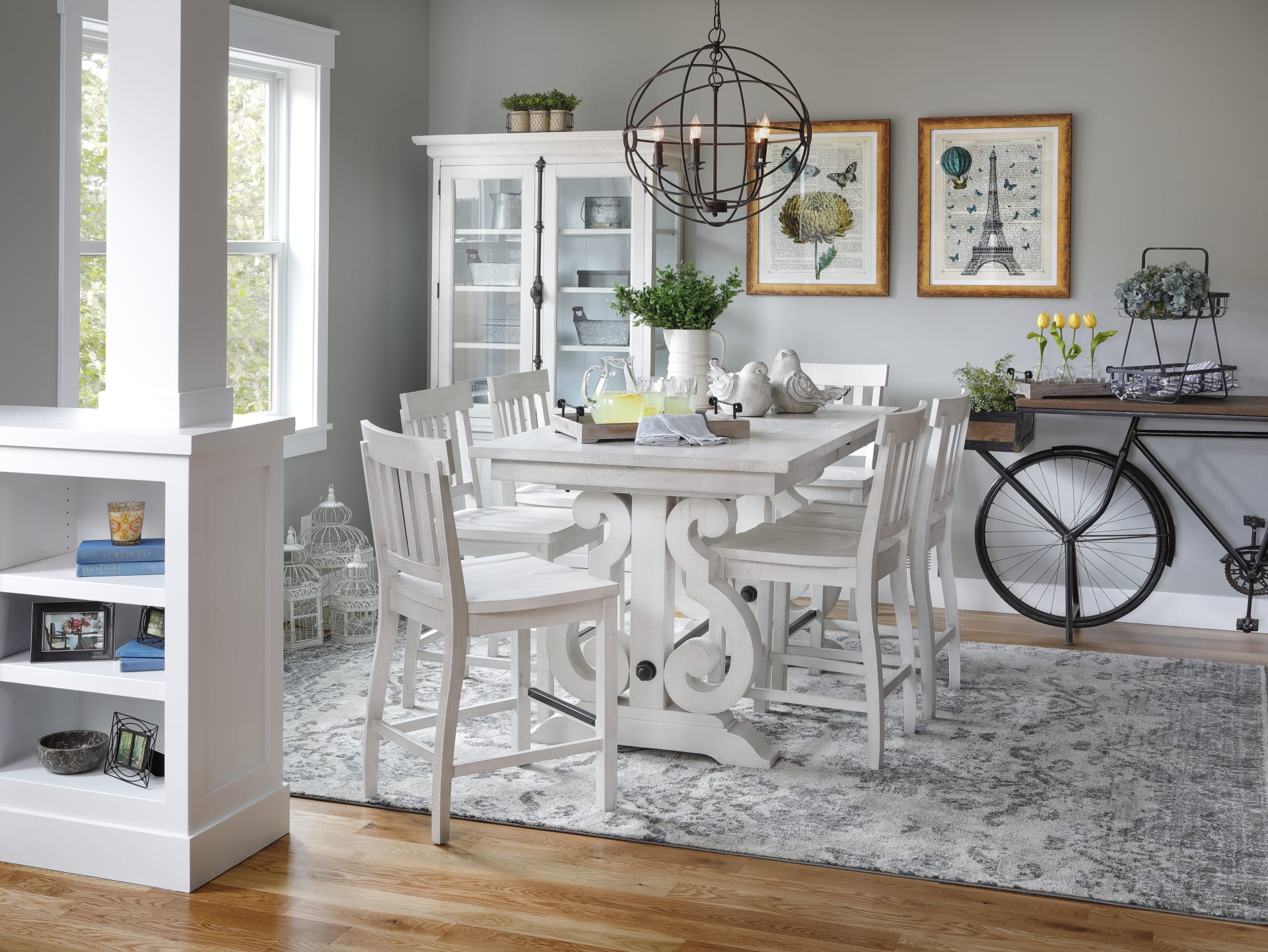 Dining room with white finished table, chairs, and cabinet