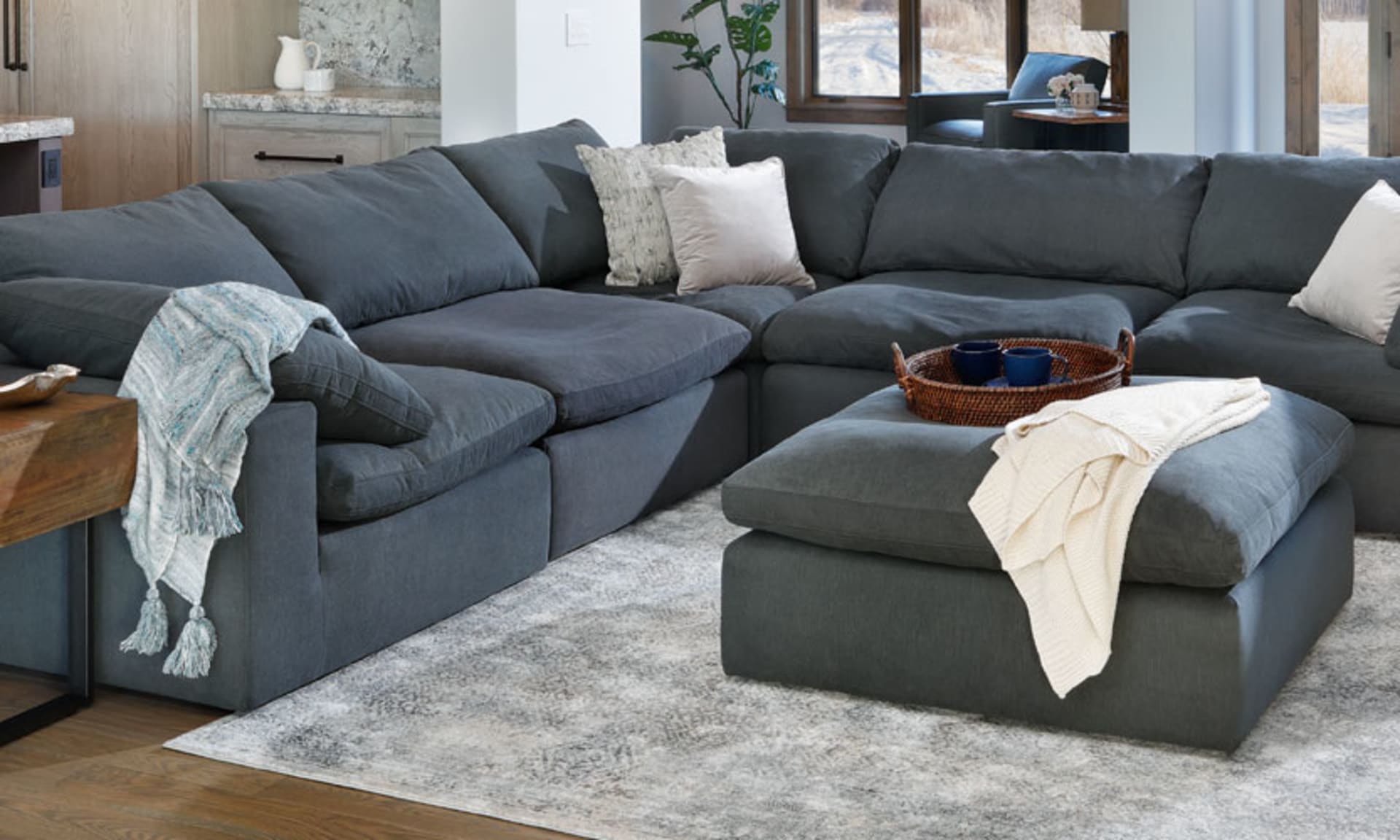 The modular Luscious Sectional in Pepper with matching Ottoman