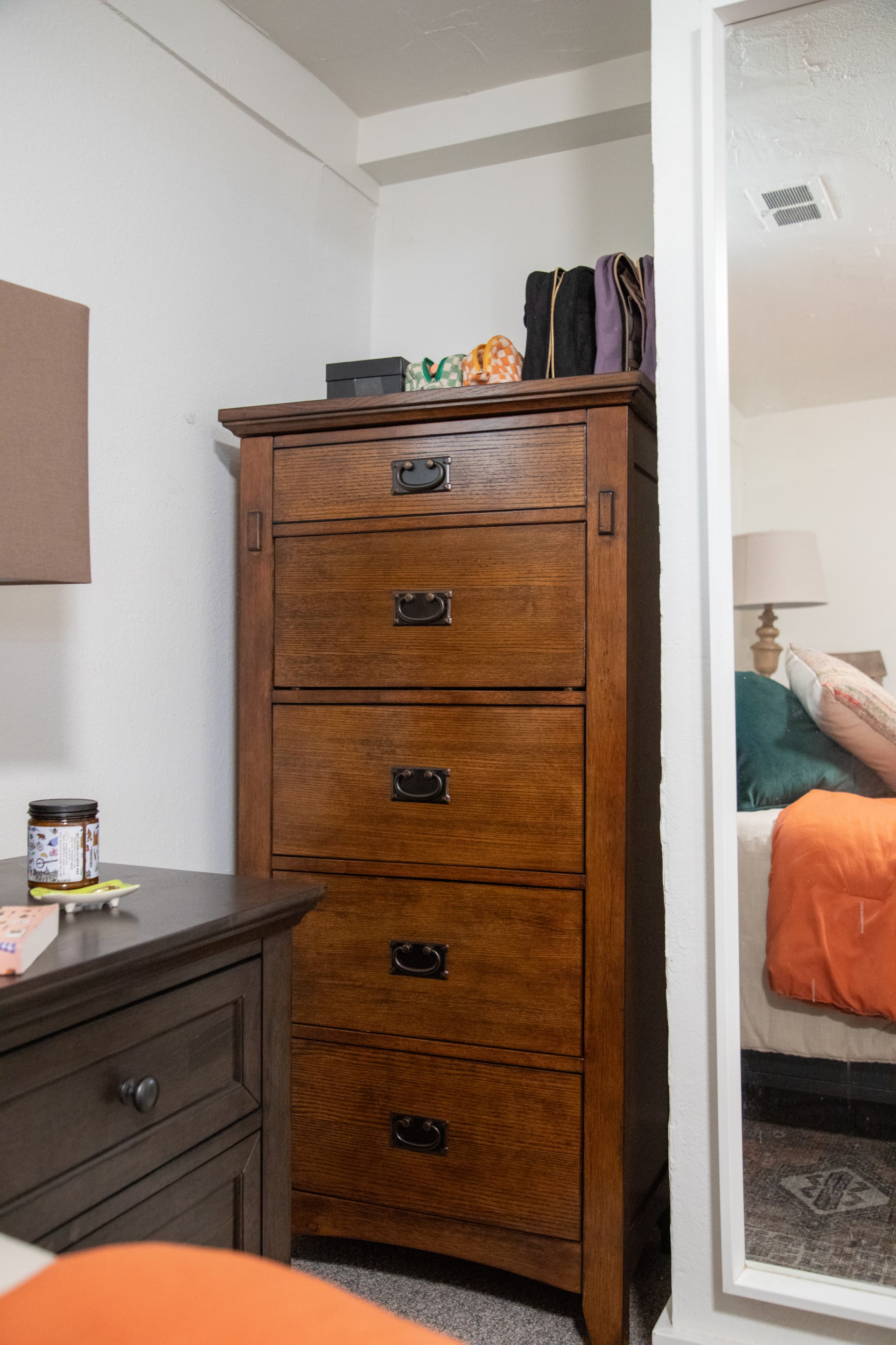 The Cristo Lingerie Chest styled in a nook of Mackinley's apartment bedroom