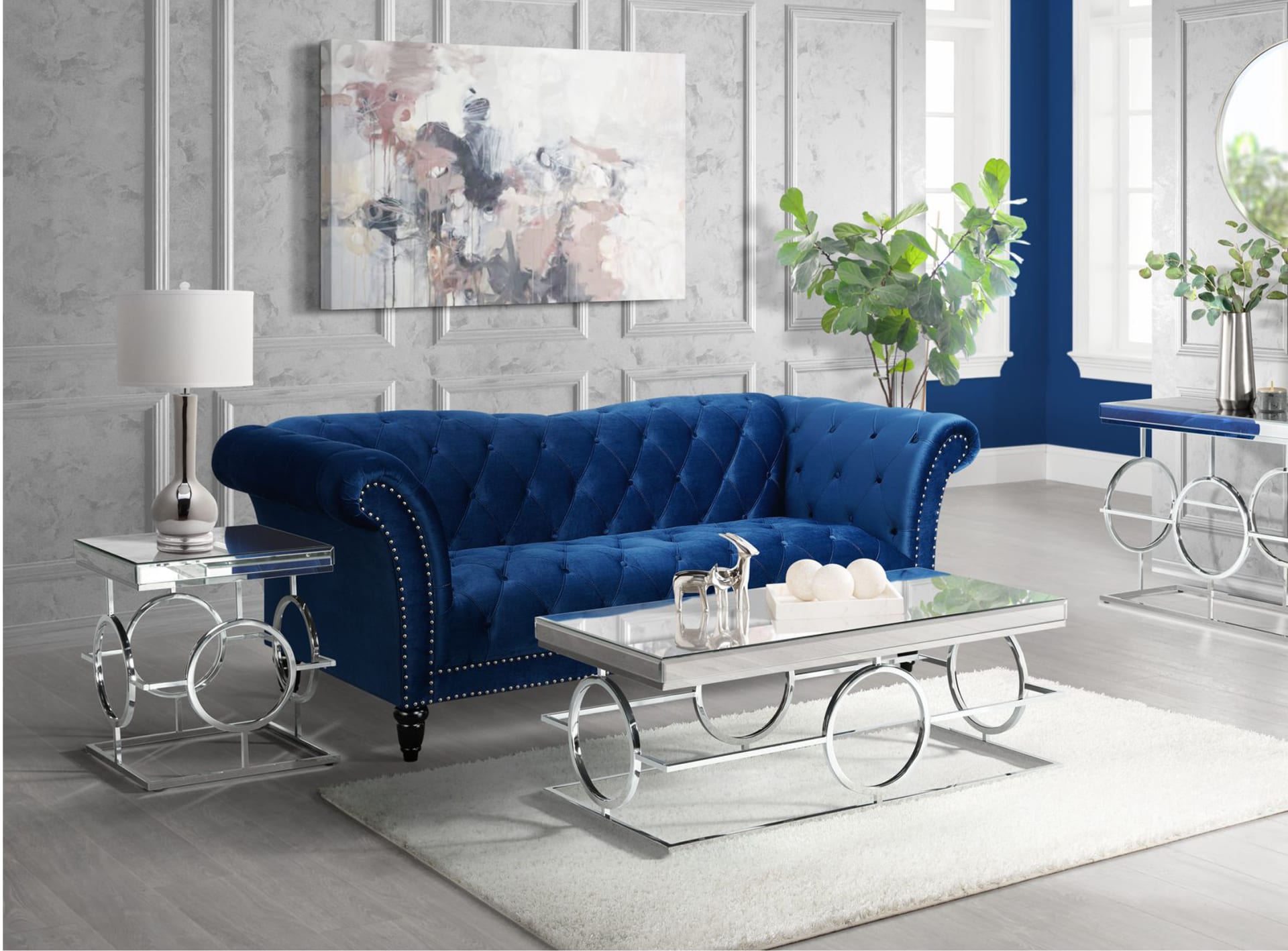 Modern, glamorous occasional tables with a curvy blue sofa in a modern room