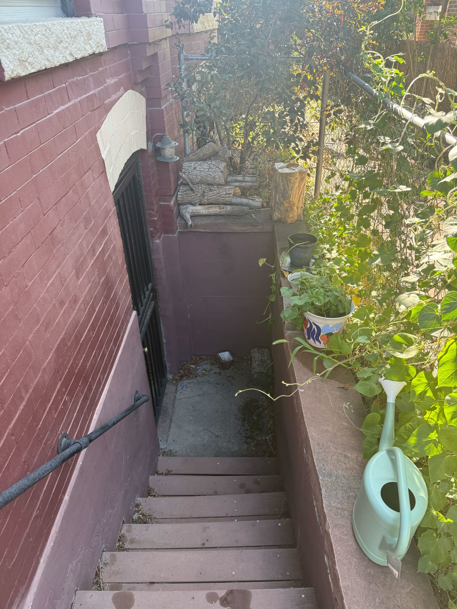 An exterior photo of Mackinley's home staircase that leads to her basement apartment