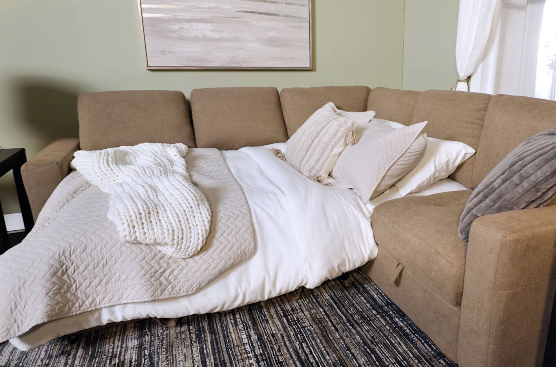 Cafe Brown Sectional with Sleeper portion made up as a bed