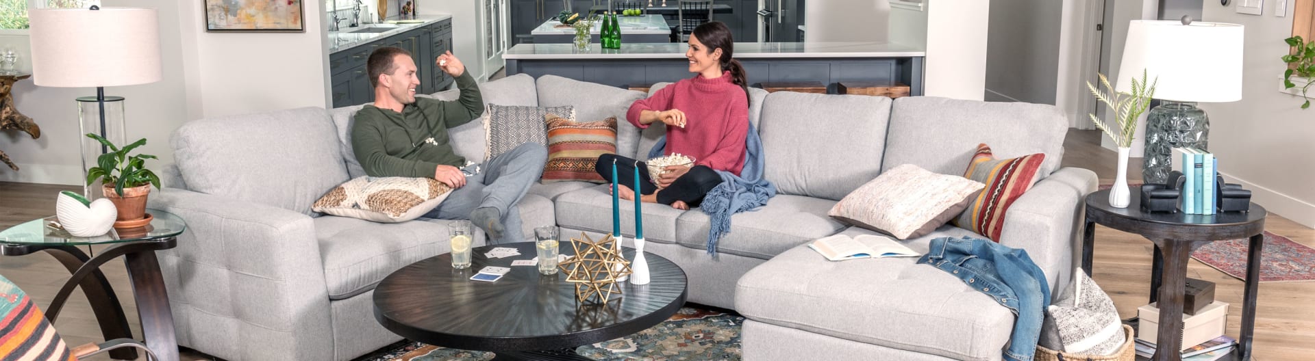 Couple hanging out on Krisha Sectional in Modern boho designed living room