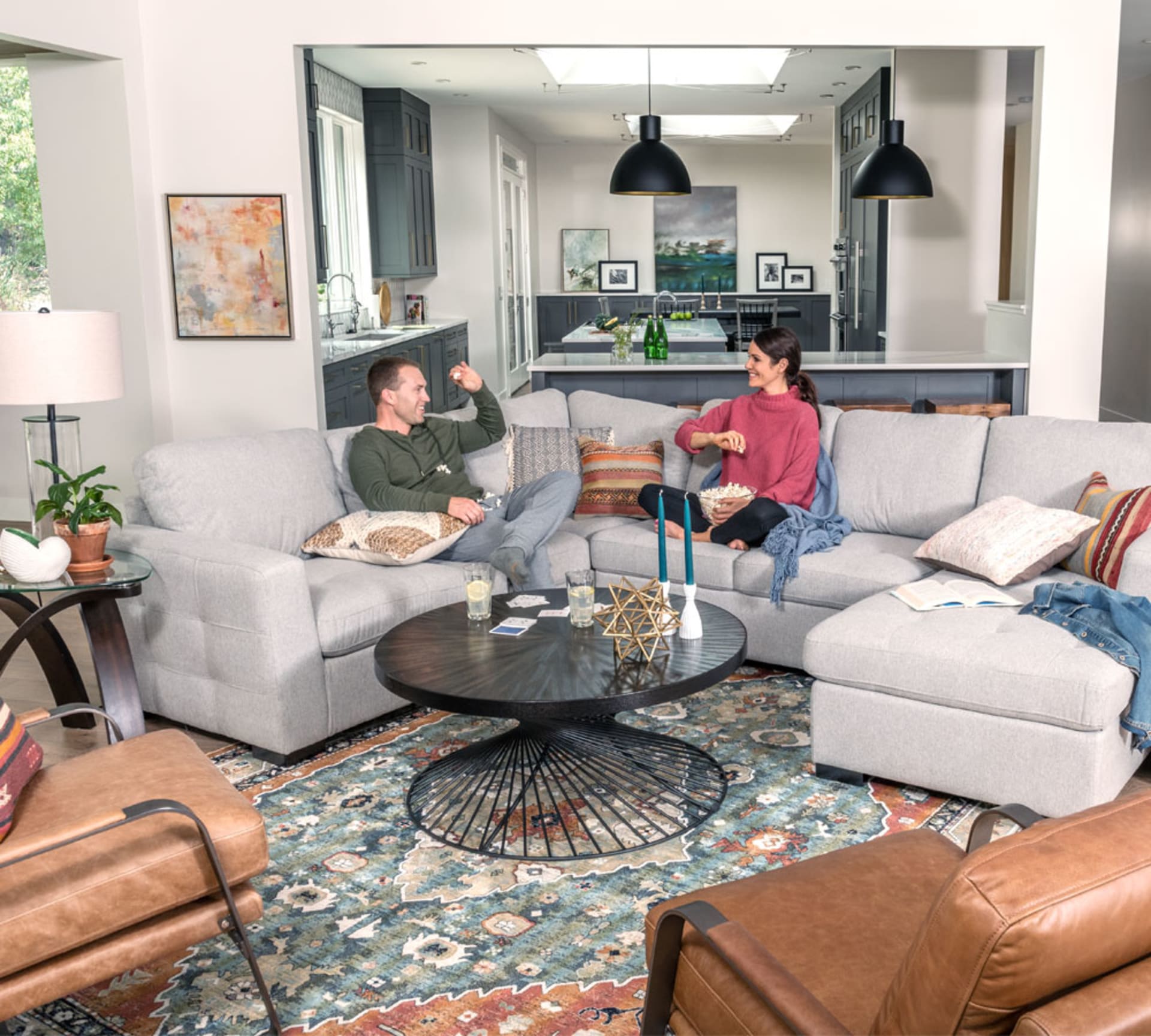 Couple hanging out on Krisha Sectional in Modern boho designed living room