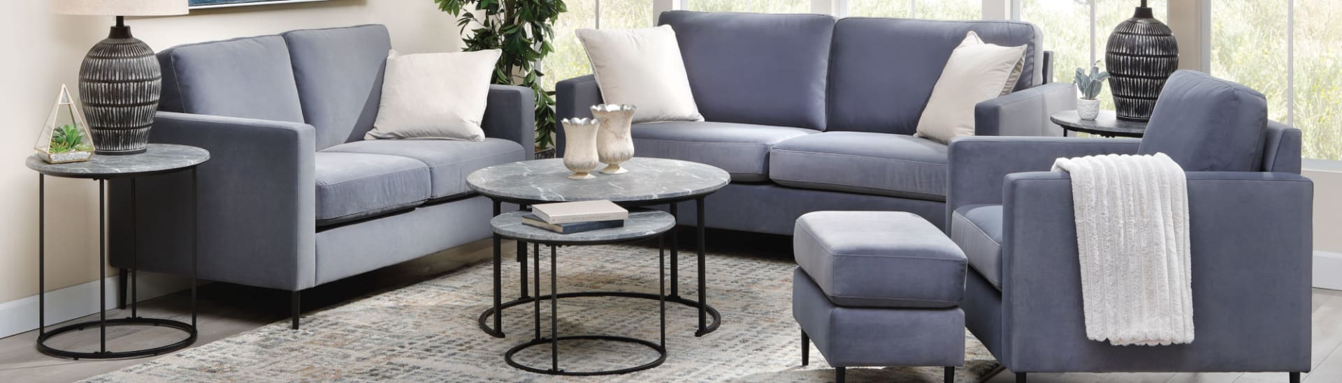 A cozy sofa group with round coffee tables in room