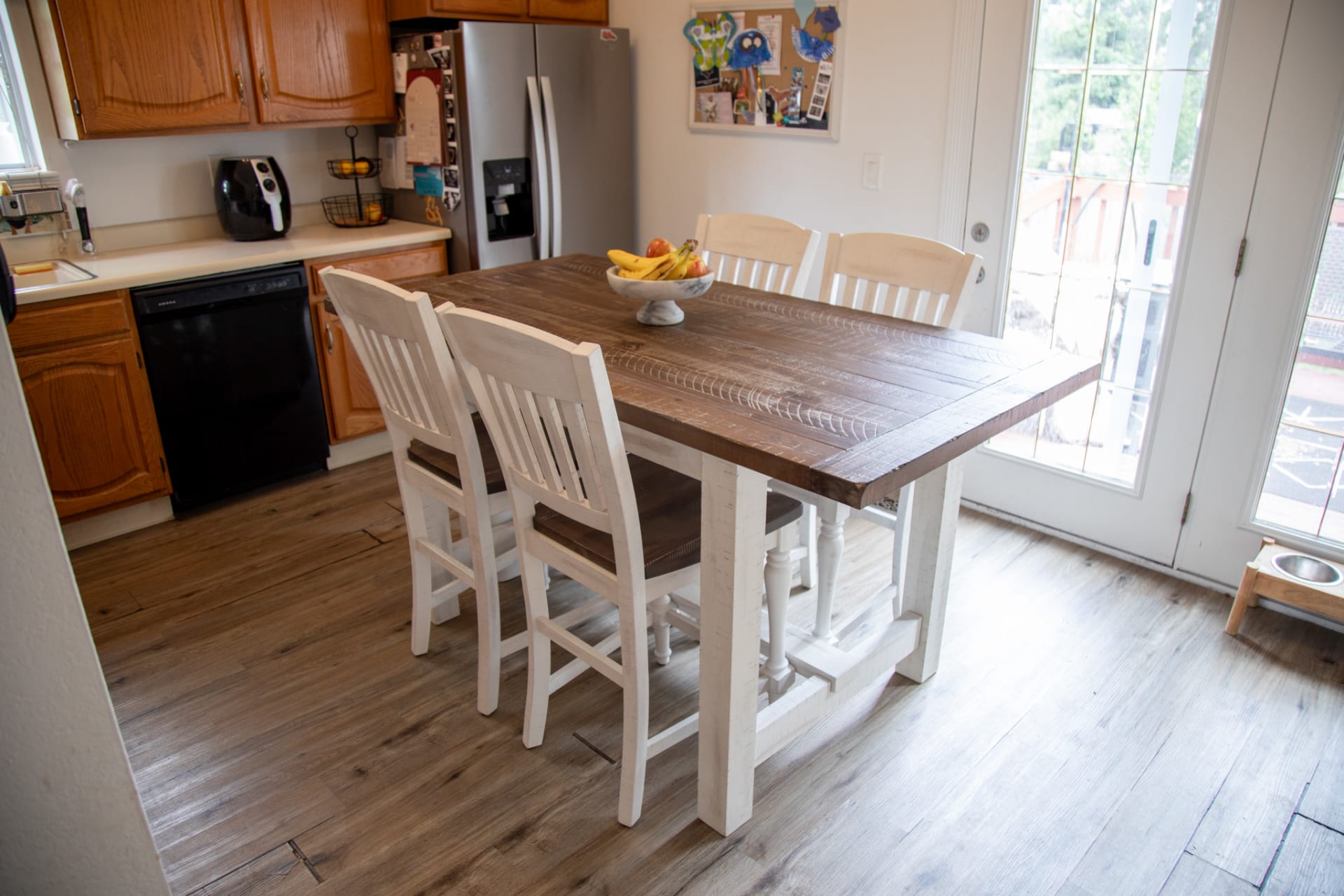 A modern farmhouse counter height dining set in a kitchen space