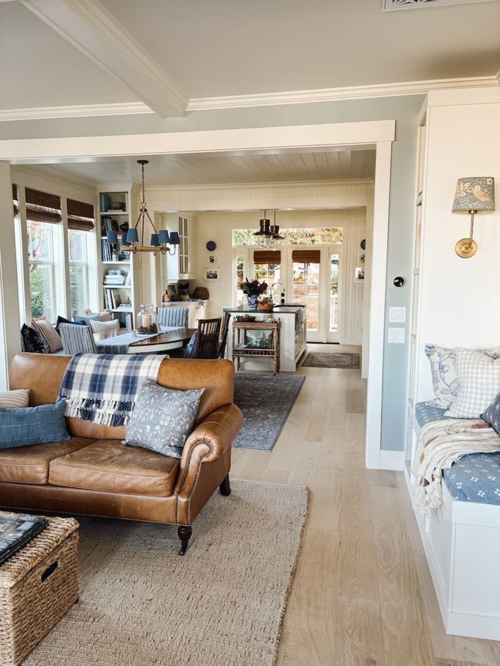 An open space living room and dining room with coastal decor