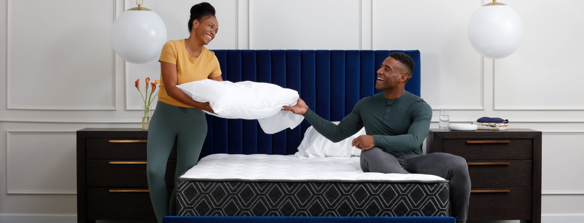 Couple Making bed with Doctor's Choice Hybrid Mattress