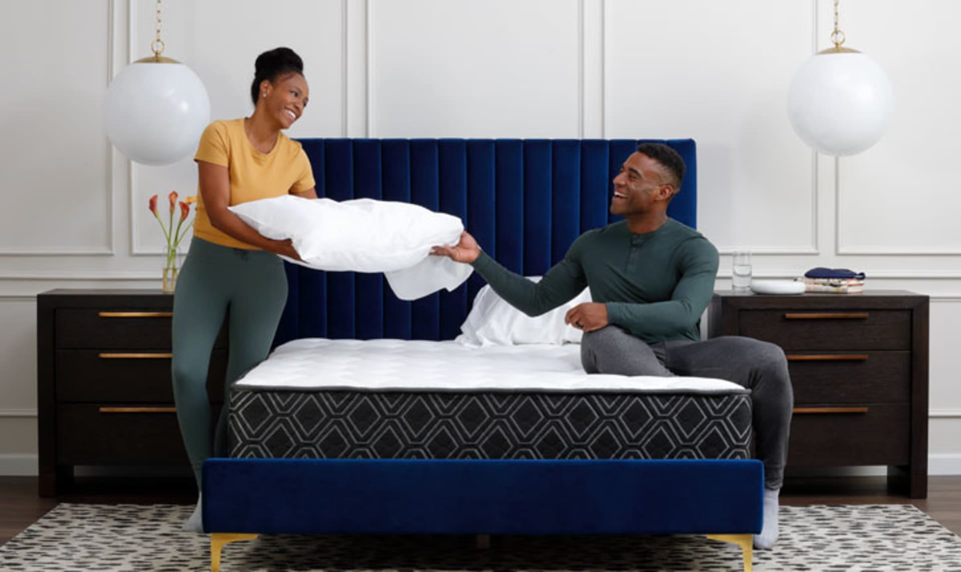 Couple Making bed with Doctor's Choice Hybrid Mattress