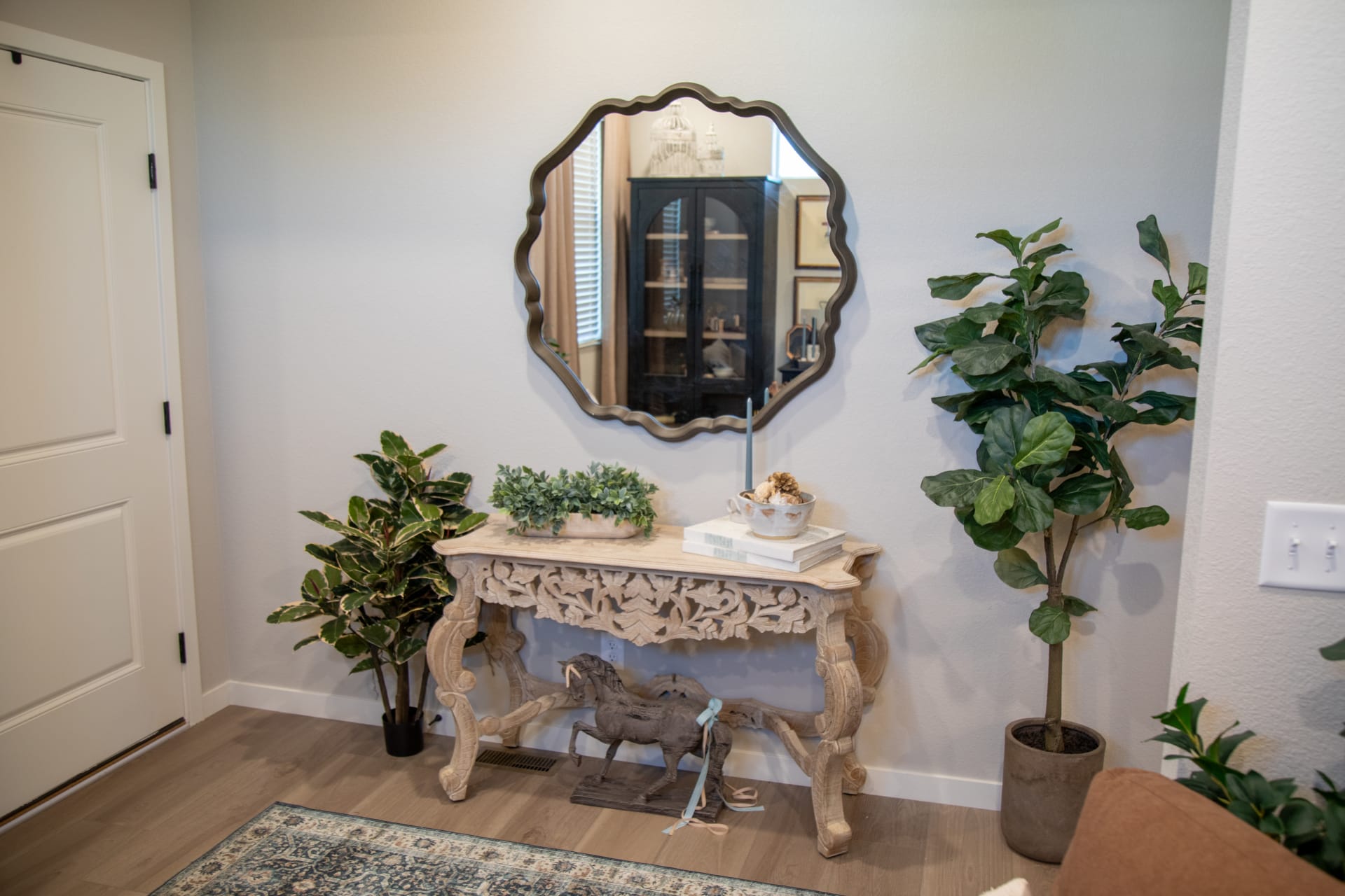 The carved Moradabad Console Table in an entryway