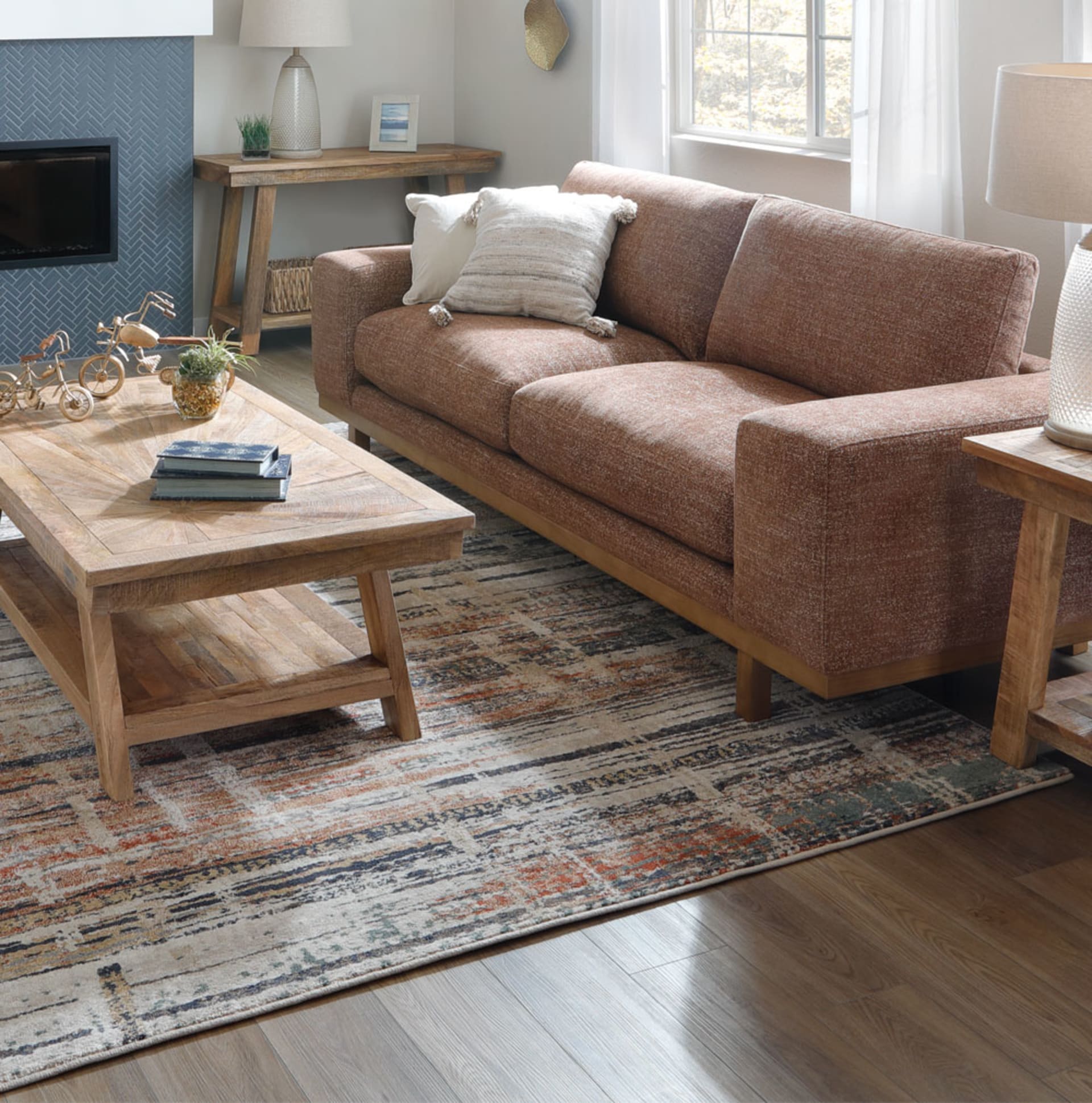 Woven Teracotta colored Sofa with wooden base in living room
