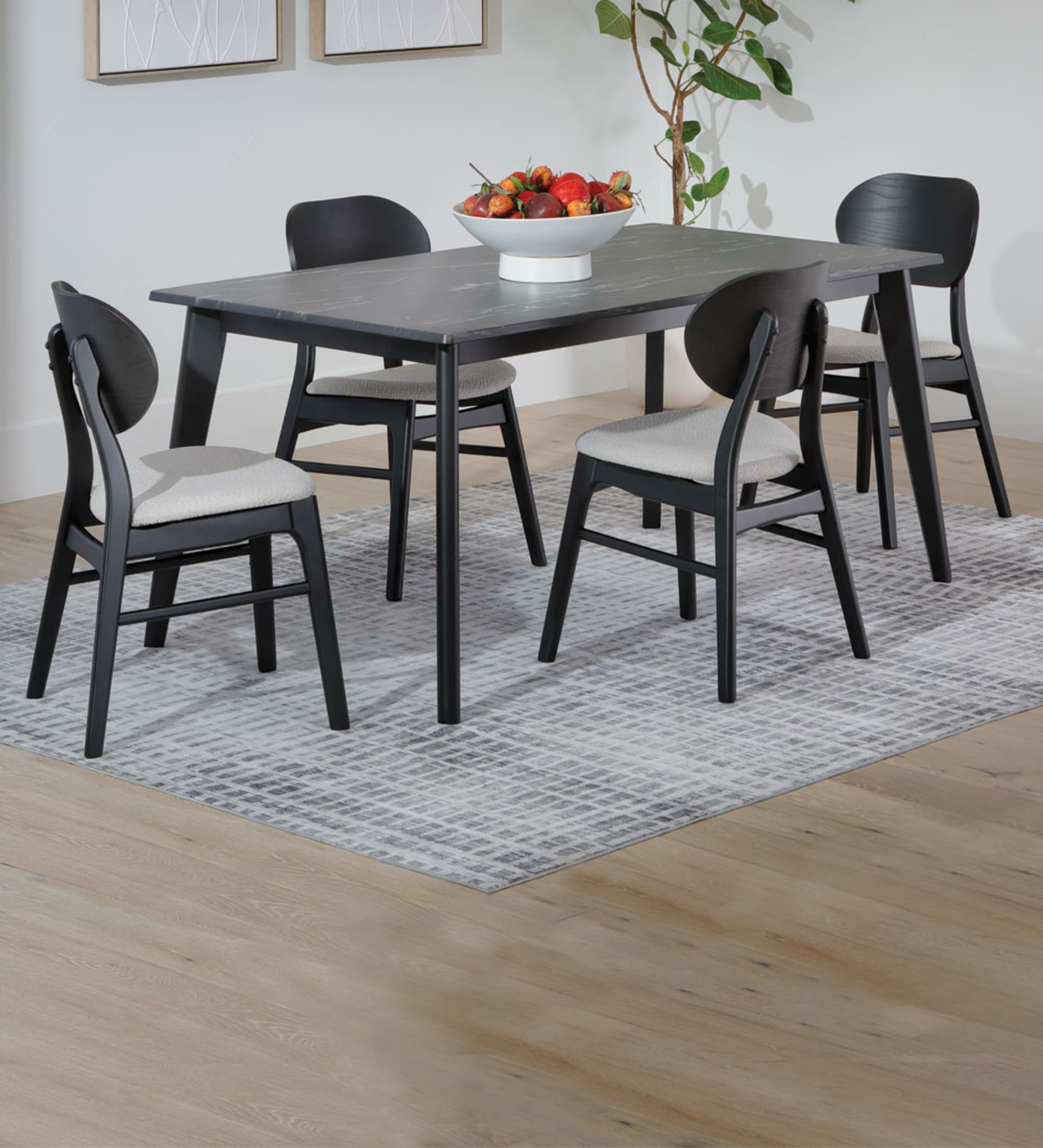 Gray Stone Top Dining Table with Black Chairs and Legs in Dining Room