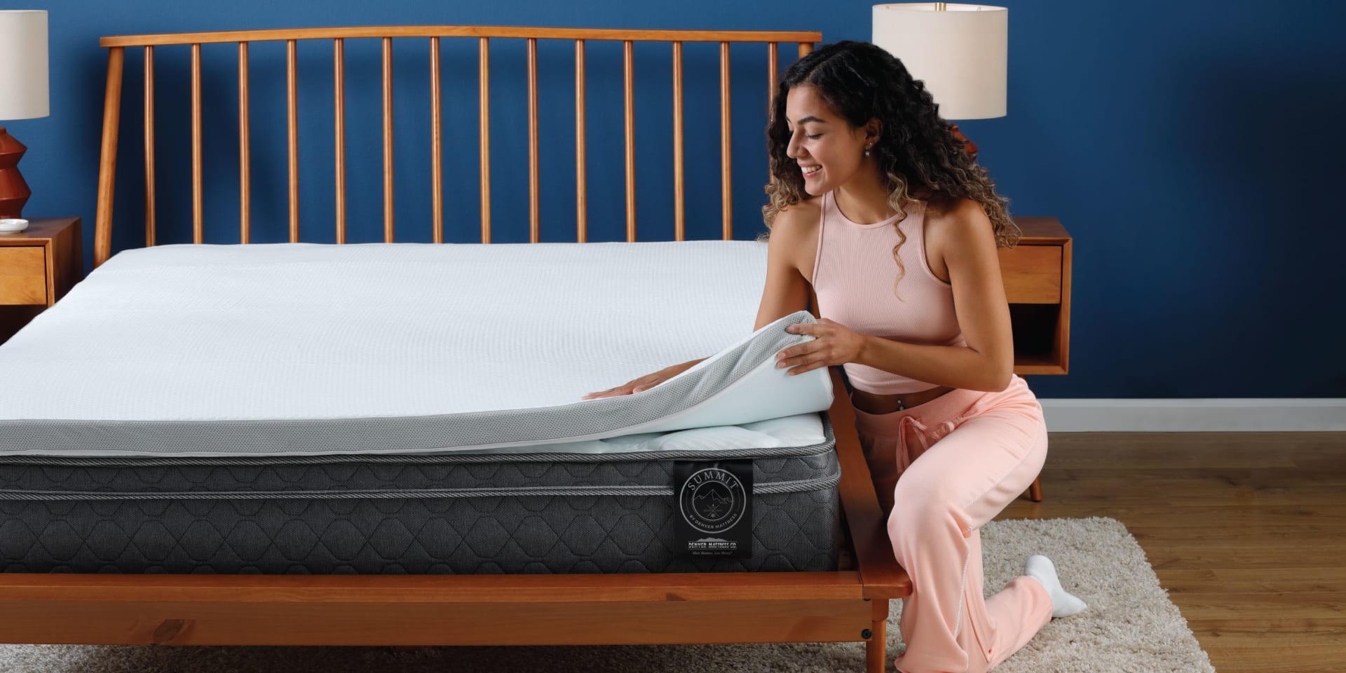 Woman putting mattress protector on