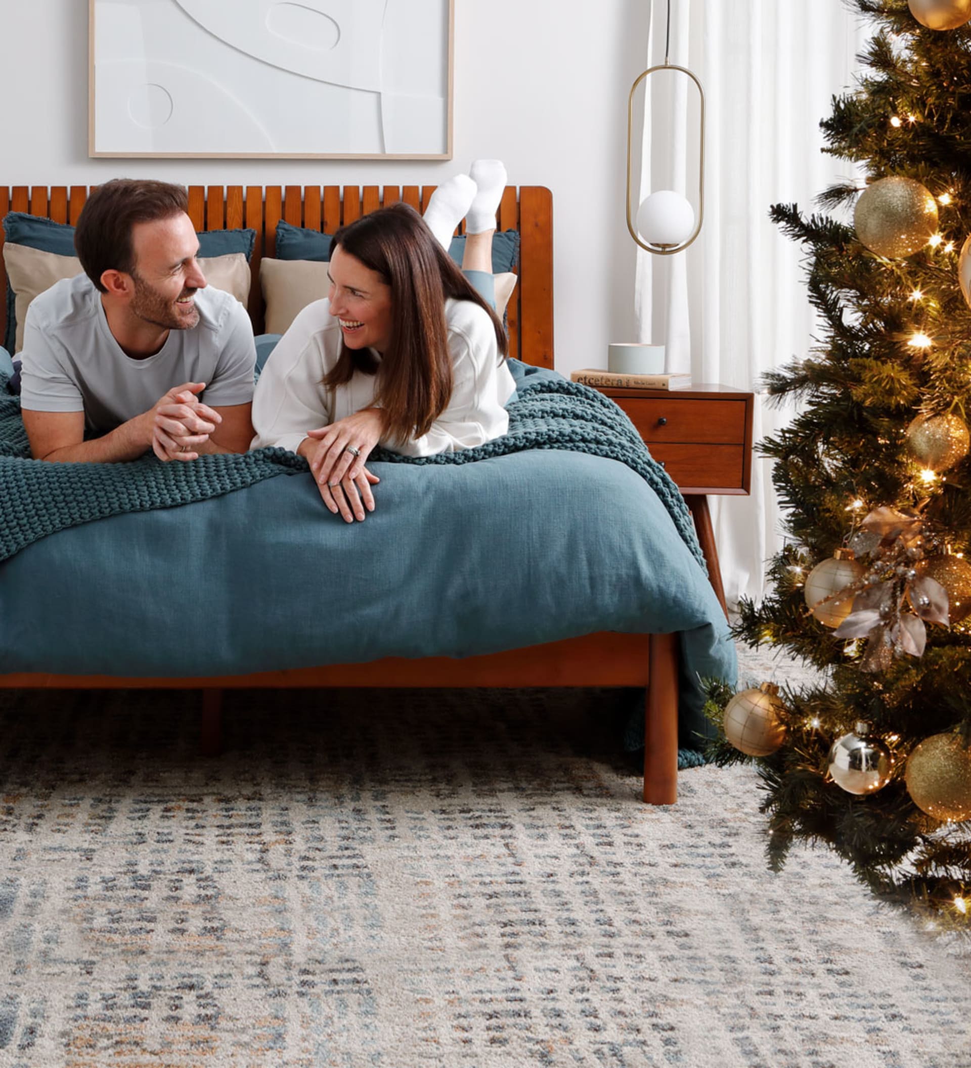 Couple in Christmassy Denver Mattress Room