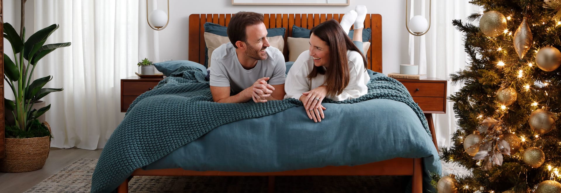 Couple in Christmassy Denver Mattress Room
