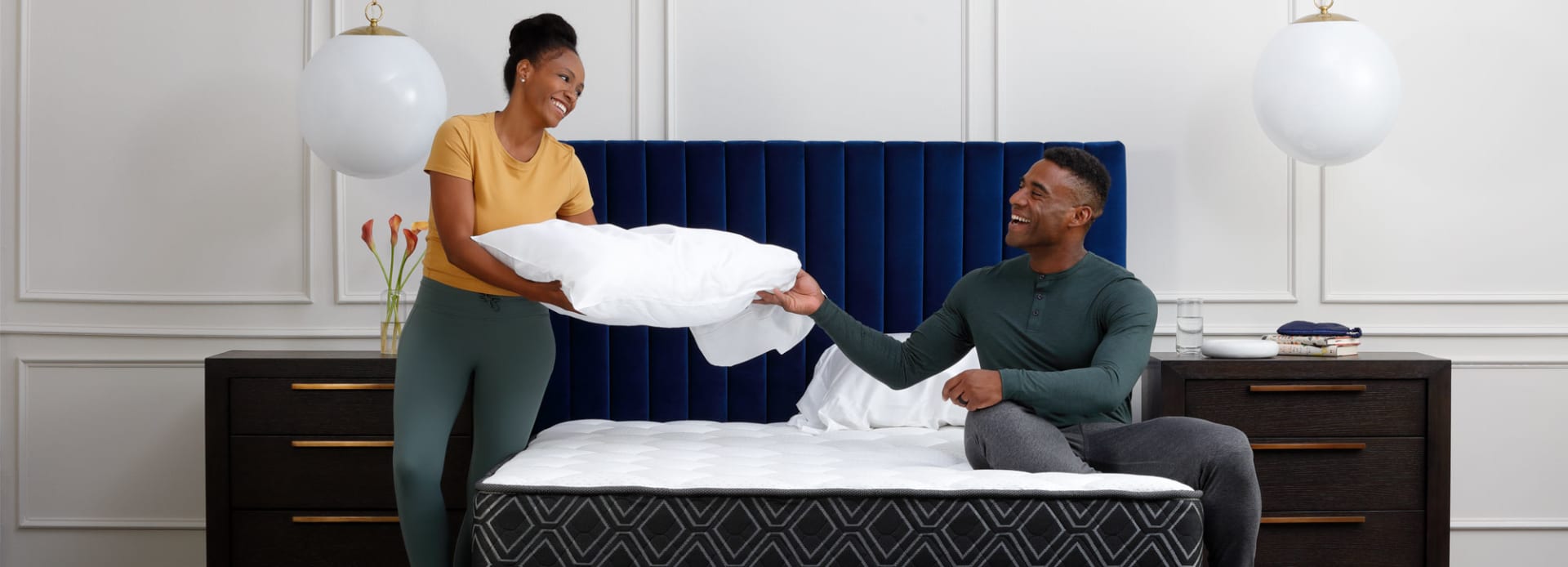 Couple Making bed with Doctor's Choice Hybrid Mattress