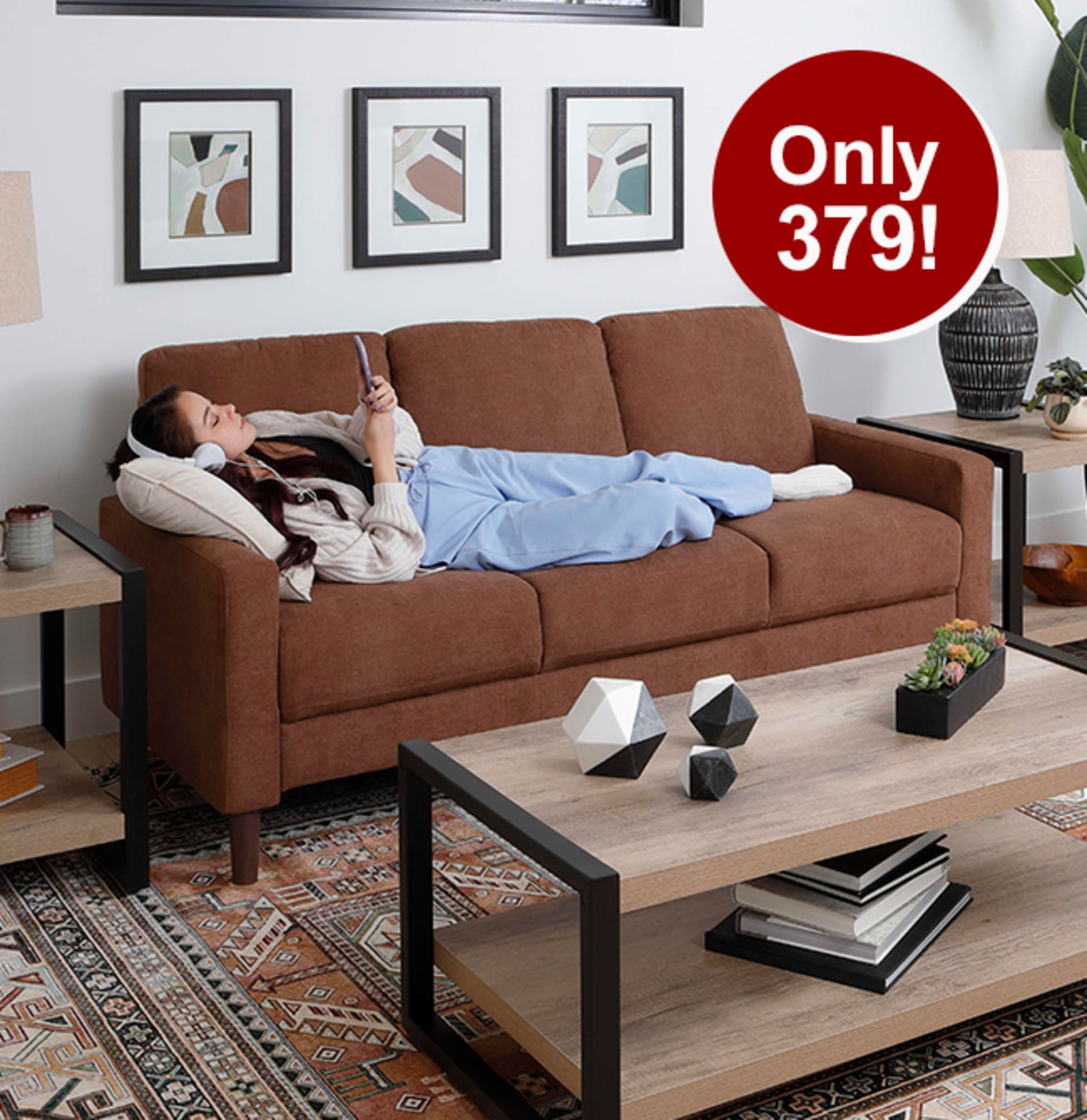 Girl laying on Devon Sofa Bronze looking at phone