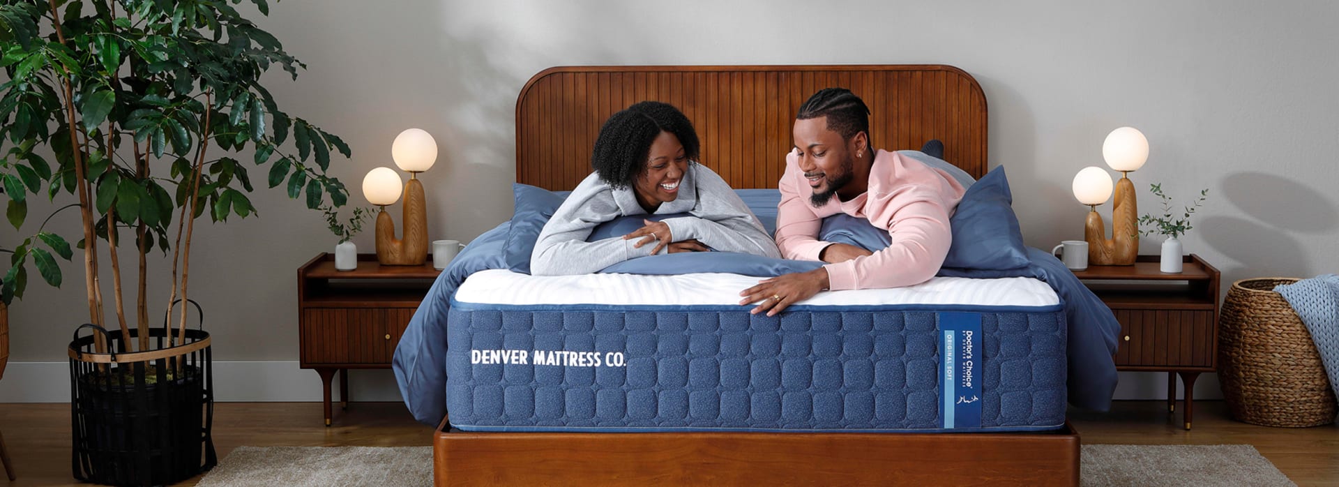 Couple Laying on Doctor's Choice Firm Mattress