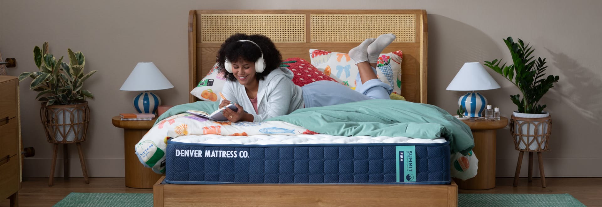 Girl Doing homework and listening to music on Summit Firm Mattress in Bedroom