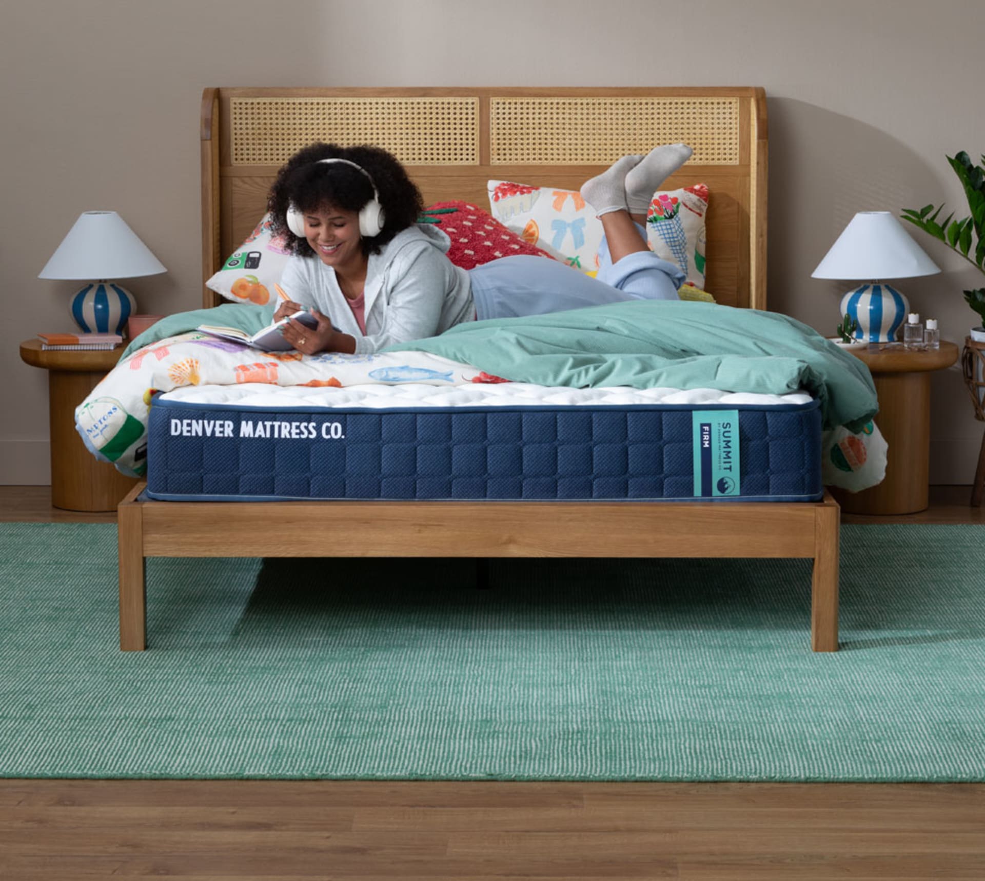 Girl Doing homework and listening to music on Summit Firm Mattress in Bedroom