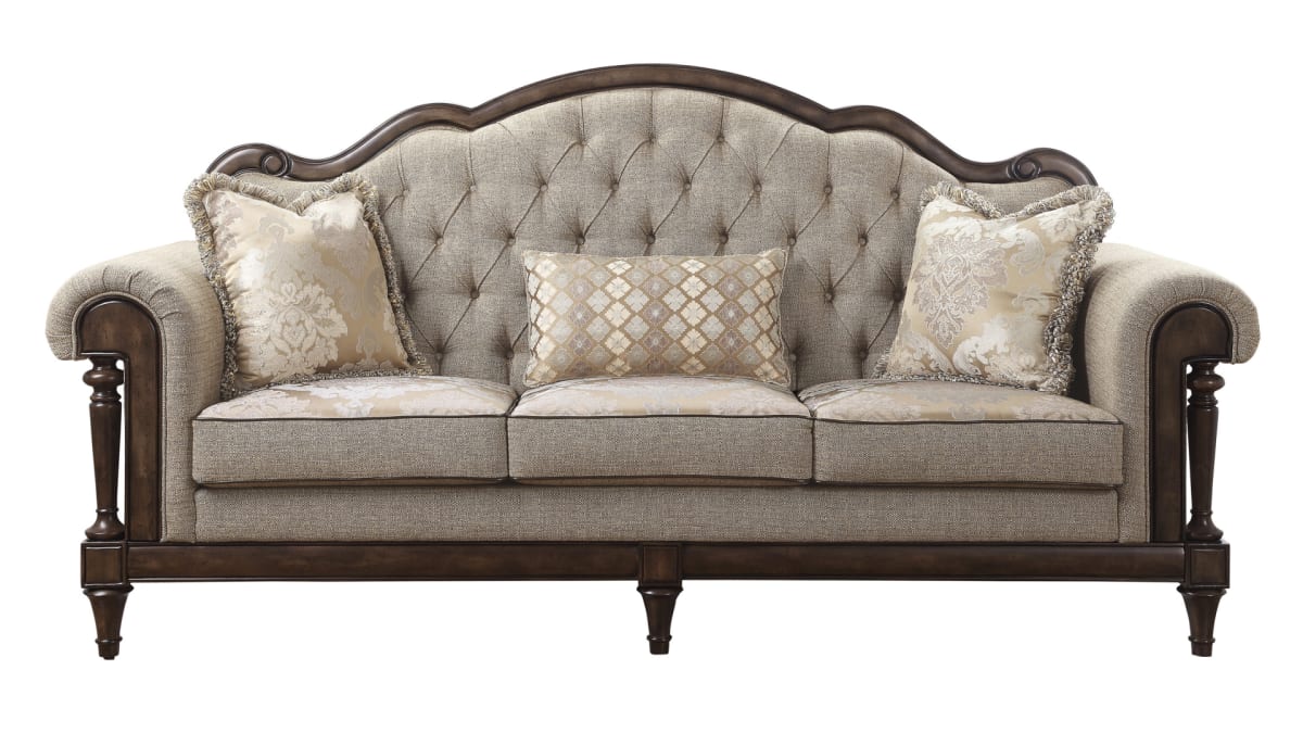 A wood-framed rococo sofa, the Darwan Sofa, on a white background