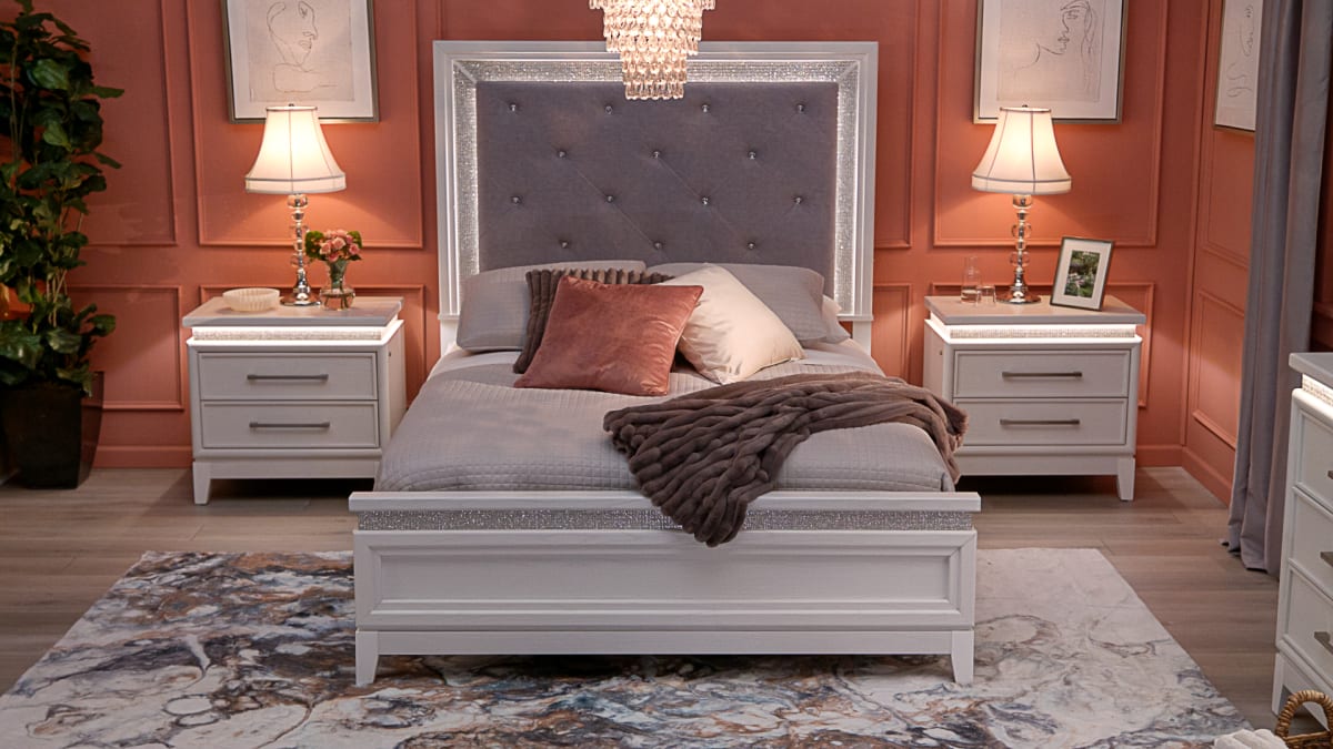 Glam Bedroom with bed that has a sparkle frame upholstered headboard