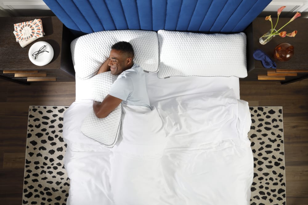 Man Snuggling with Doctor's Choice Elite Pillow in bed
