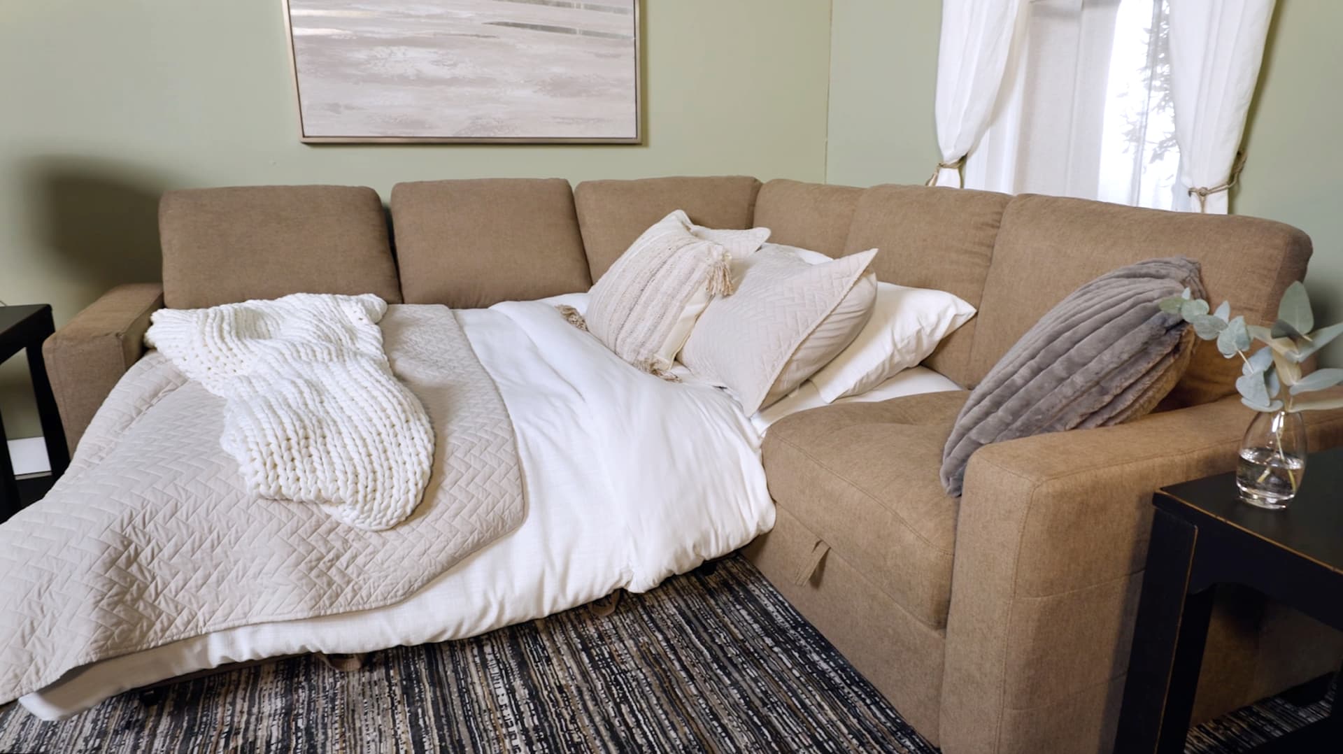 Cafe Brown Sectional with Sleeper portion made up as a bed