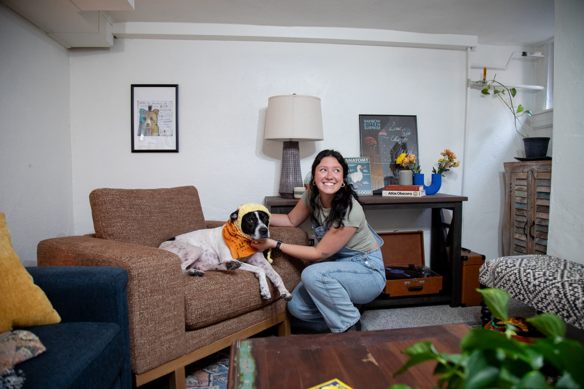 Mackinley posed next to her dog in the Laguna Chair, phographed in her living room
