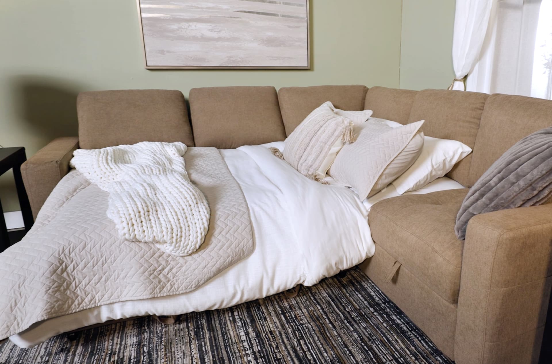 Cafe Brown Sectional with Sleeper portion made up as a bed