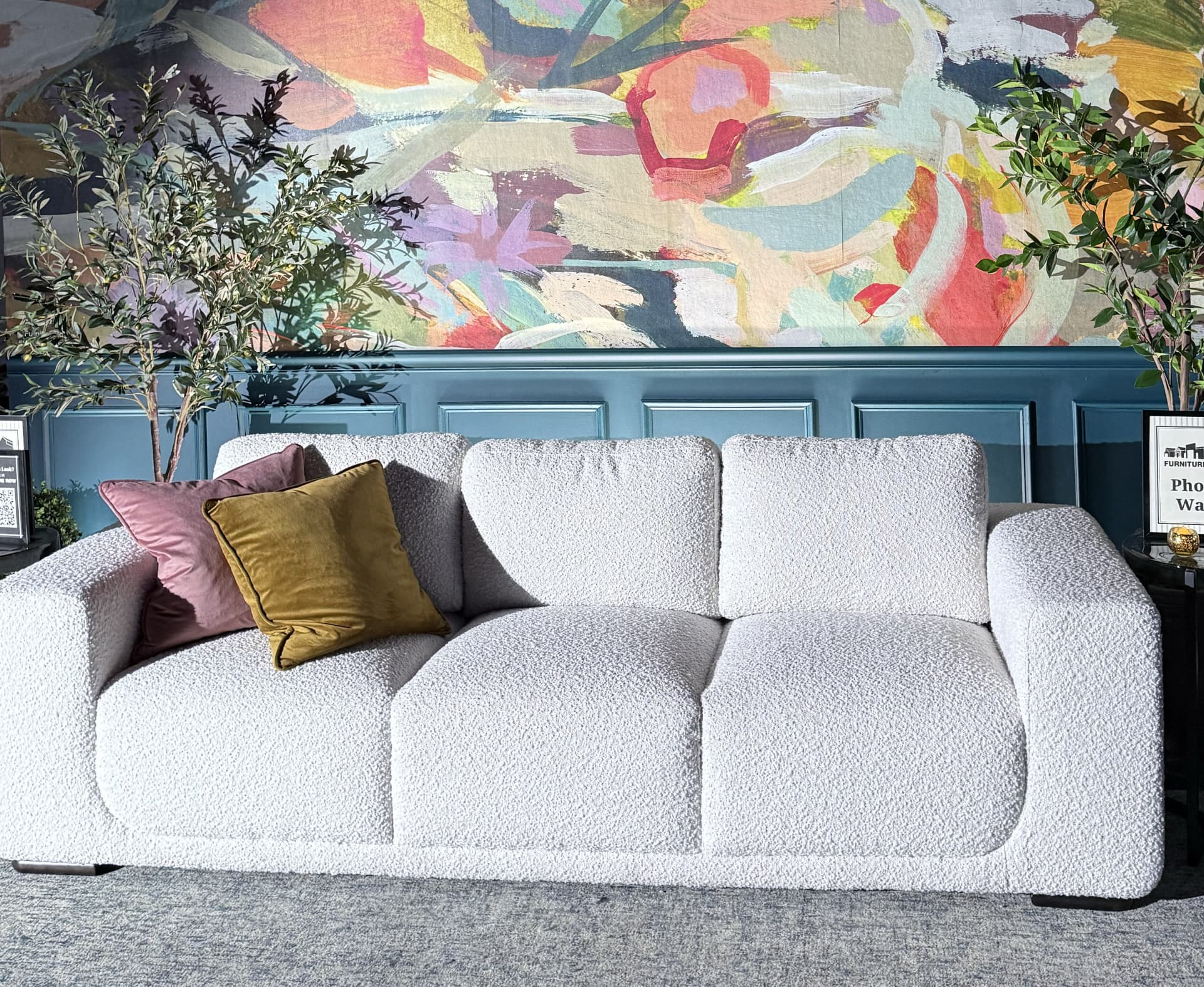 White Boucle Sofa in Front of Colorful Wall