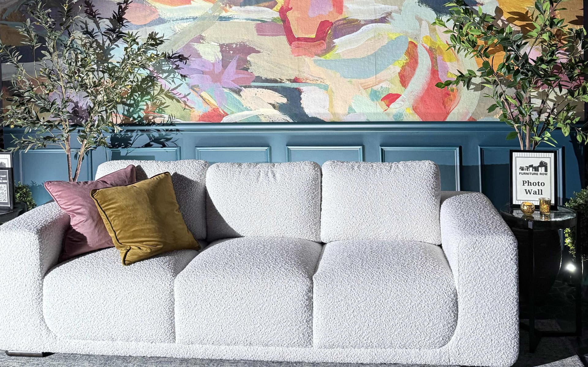 White Boucle Sofa in Front of Colorful Wall