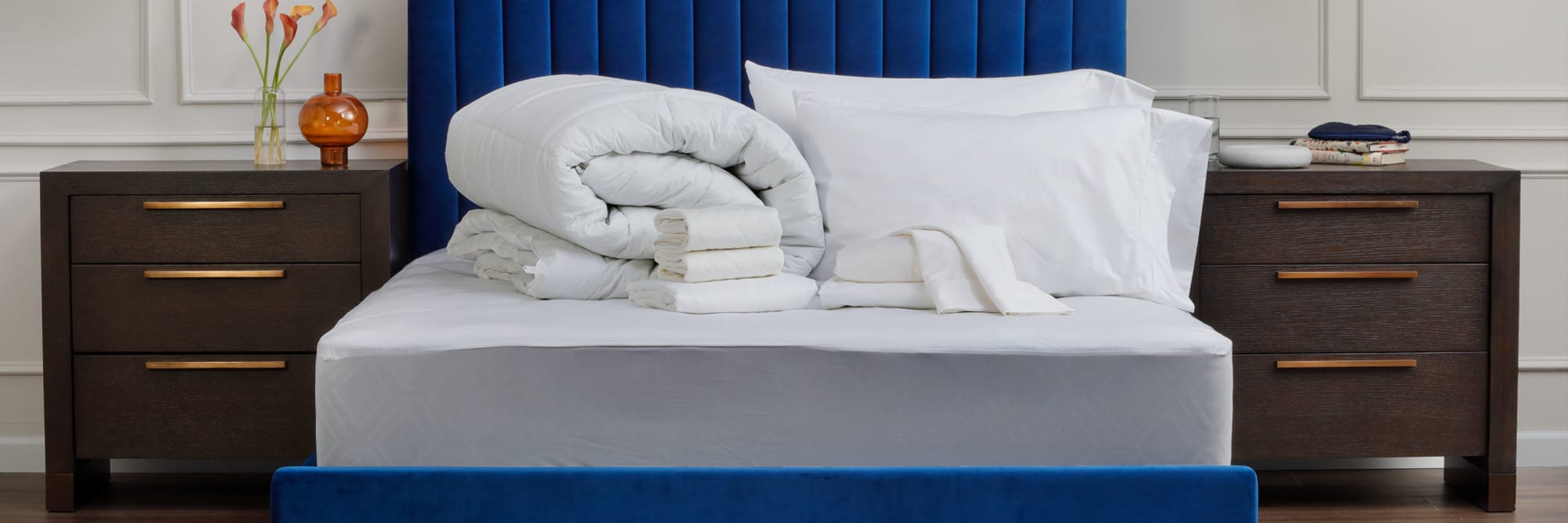 Sheets laid out on bed