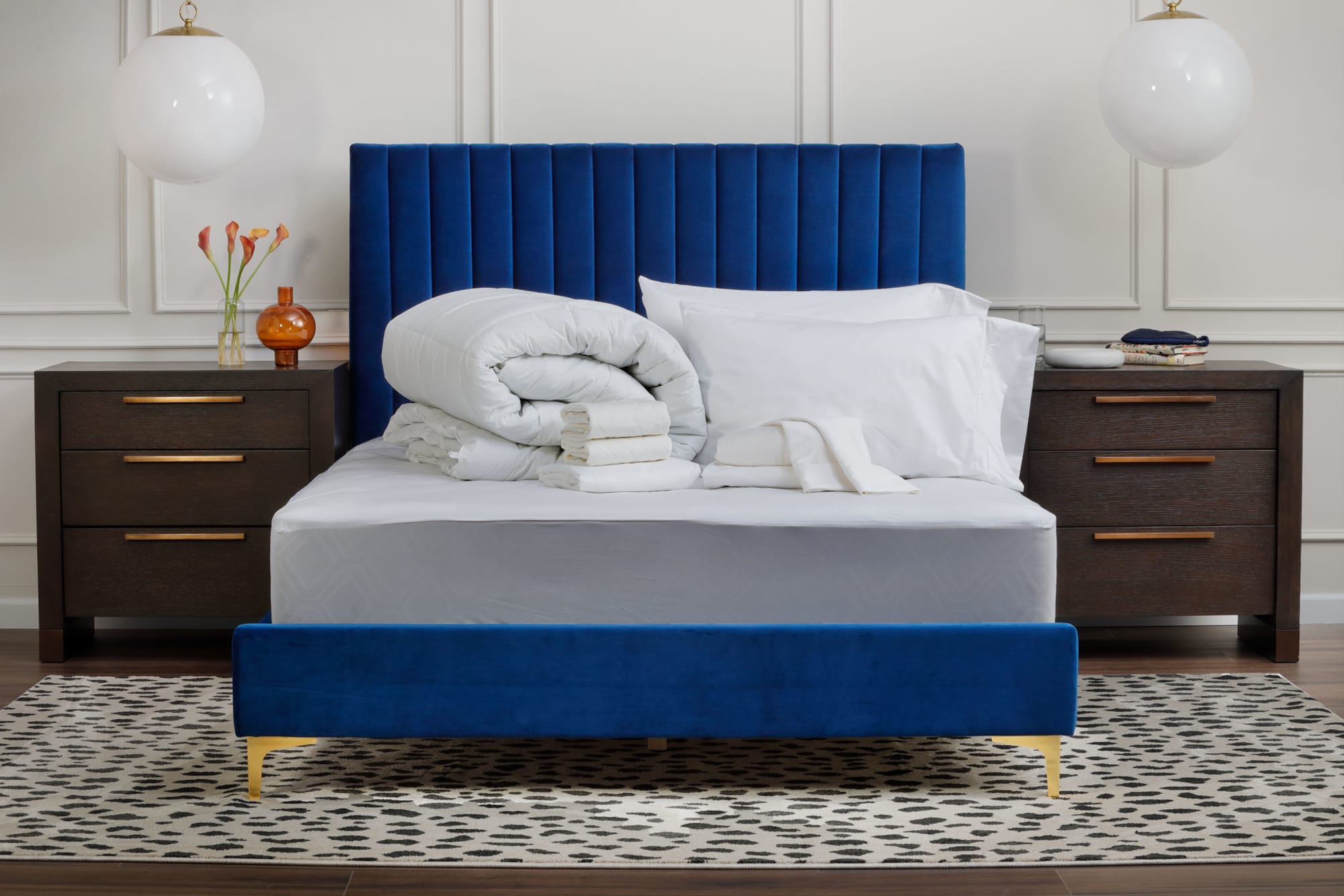 Sheets laid out on bed